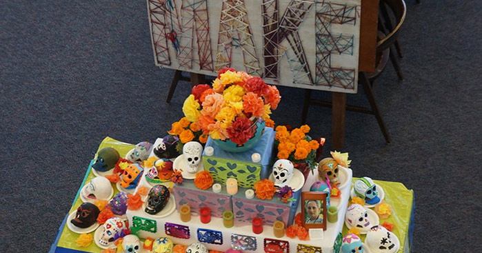 A Makerspace Dia de los Muertos altar memorializes longtime CSM Communications Professor George Kramm,