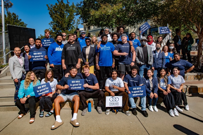 Taylor-Mendoza surrounded by CSM students and employees at a SB 893 Free College rally