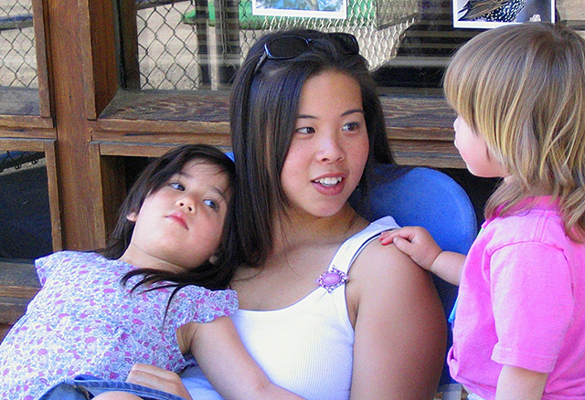 CSM Child Development Center Coordinator Maggie Barrientos interacting with young students